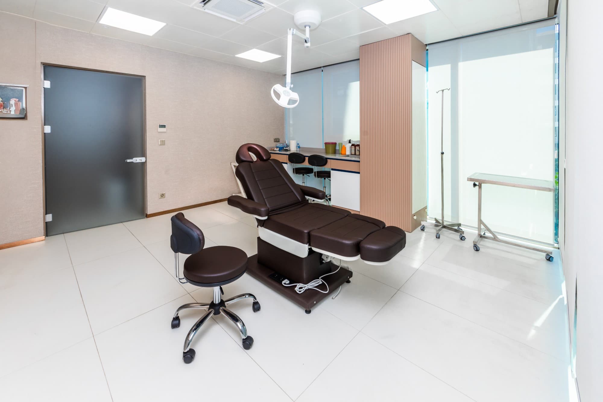 Renewa Clinic treatment room with a reclining chair and IV stand